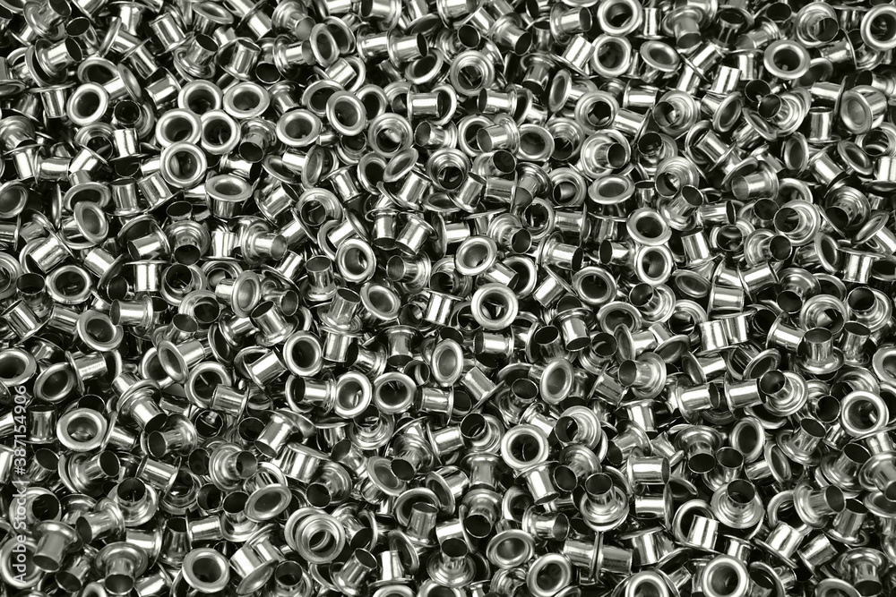 Wall mural Metal eyelets for sewing. Grommets for clothes.