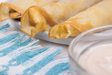 Thin crepes with fillings.