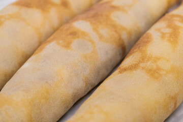 Thin crepes with fillings.