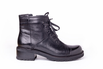 Black leather boot isolated on white background. Stylish women's shoes