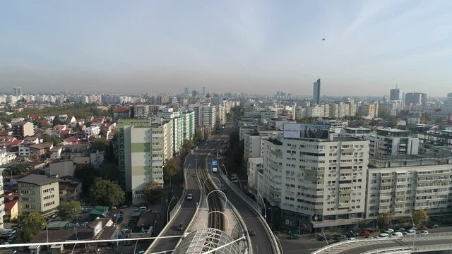 Traffic on the Basarab Suspended Bridge on a sunny day in Bucharest.