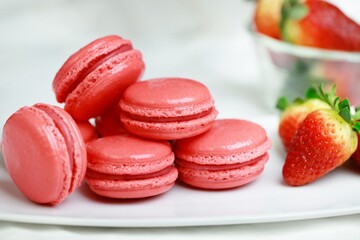 Set of Many tasty macarons purple pink on bright background. a pattern of colorful french cookies. homemade food.