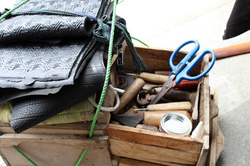 Fototapeta na wymiar The equipment used for manual shoe sole sticthing
