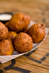 Hush puppies. Deep fried cornmeal made with onions, garlic and butter. Classic Cajun cuisine appetizer favorite. Classic New Orleans cuisine.