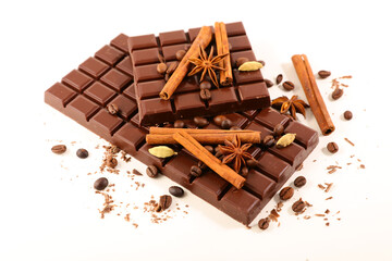 chocolate bar and spices on white background