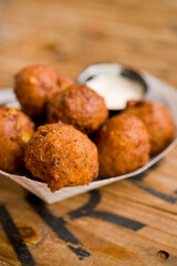 Hush puppies. Deep fried cornmeal made with onions, garlic and butter. Classic Cajun cuisine appetizer favorite. Classic New Orleans cuisine.