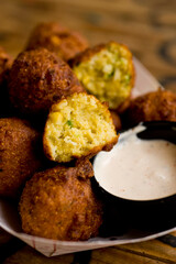 Hush puppies. Deep fried cornmeal made with onions, garlic and butter. Classic Cajun cuisine appetizer favorite. Classic New Orleans cuisine.