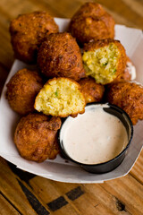 Hush puppies. Deep fried cornmeal made with onions, garlic and butter. Classic Cajun cuisine appetizer favorite. Classic New Orleans cuisine.