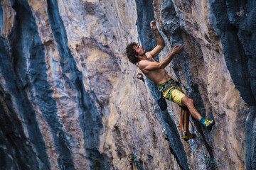 A strong man climbs a rock, Rock climbing in Turkey.