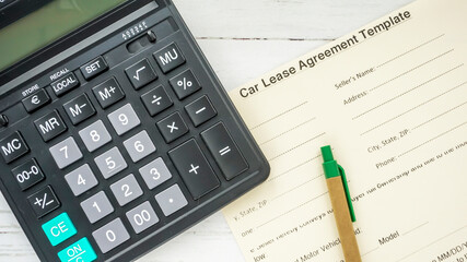 Global Leasing Day. calculator and pen on a beautiful background photo