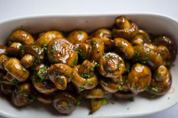 Mushrooms roasted in garlic, onions, olive oil and fresh herbs and spices. Classic American steakhouse or French bistro appetizer or side dish.