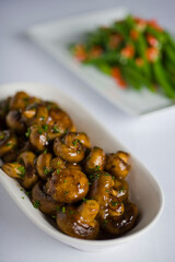 Mushrooms roasted in garlic, onions, olive oil and fresh herbs and spices. Classic American steakhouse or French bistro appetizer or side dish.