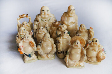 A close-up photograph of the twelve figures of Hotei (or Budai) in Japanese mythology, one of the...