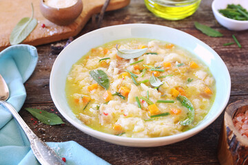 Italian cuisine. Pancotto: bread soup with  sage and grated Parmesan cheese