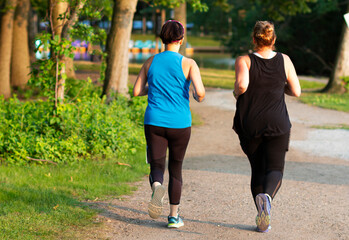 Two women jogging in a park