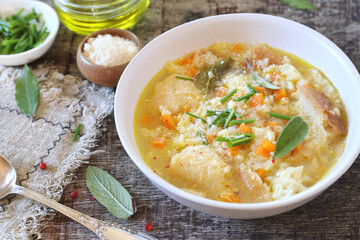 Italian cuisine. Pancotto: bread soup with  sage and grated Parmesan cheese