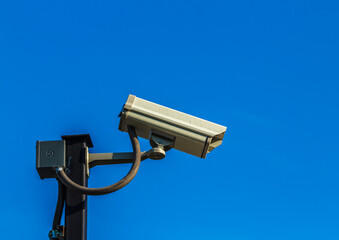 Security camera with blue sky