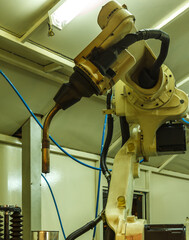 Robots welding in parts industry