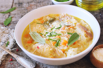 Italian cuisine. Pancotto: bread soup with  sage and grated Parmesan cheese