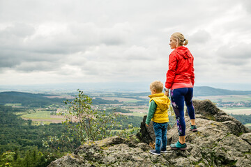 Mother with little boy travelling in mountains