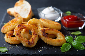 Squid rings or onion rings with sauces