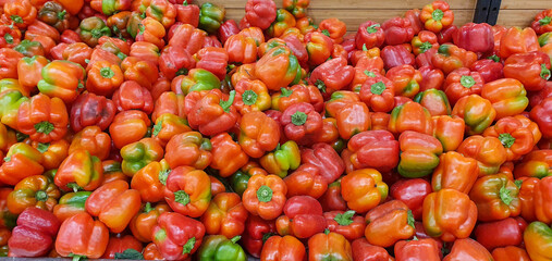 A lot of colorful bell peppers in a market