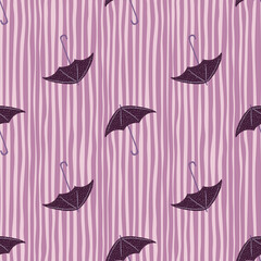 Seamless purple umbrella pattern with doodle rainy ornament. Dark purple accessory shapes with striped background.