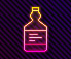 Glowing neon line Tequila bottle icon isolated on black background. Mexican alcohol drink. Vector.
