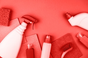 House cleaning products are on red background.