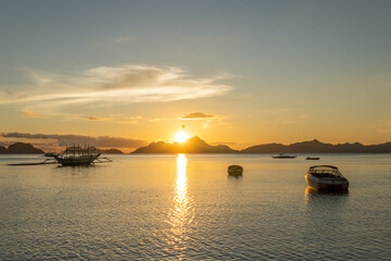 Beautiful sunset sea in El Nido with boats in the foreground