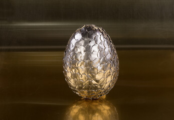 golden dragon egg on golden background