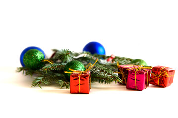 Christmas decoration on a white background. Christmas gifts and golden Christmas balls. Place for your text.
