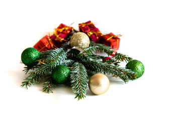 Christmas decoration on a white background. Christmas gifts and golden Christmas balls. Place for your text.
