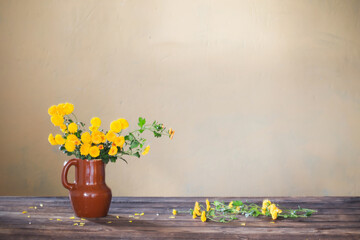 chrysanthemums in  vase on old wooden table