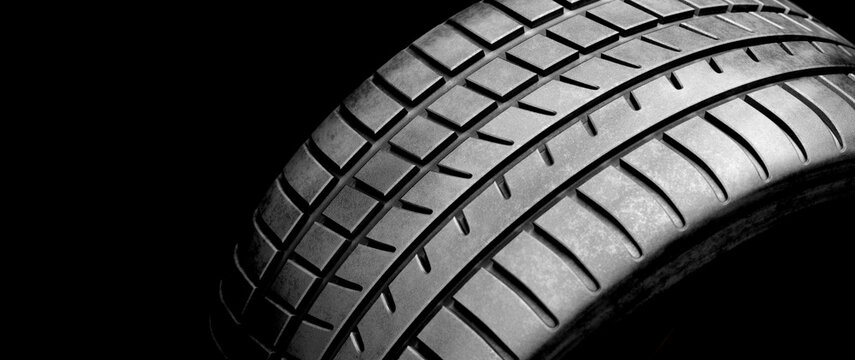 New wheel tire close-up on black