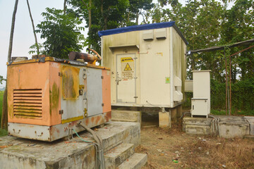 Close up of a rusted old big diseal electric generator set and mobile tower  station, selective...