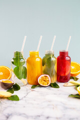 Summer lemonade drinks with fruits on blue background