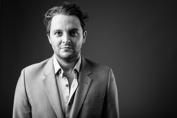 Studio shot of Italian businessman in black and white