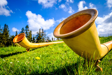 alphorns at a mountain peak