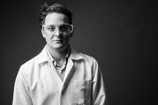 Italian Man Doctor Wearing Protective Glasses In Black And White