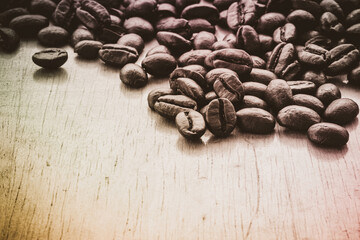 Roasted coffee beans on wooden background, black and white