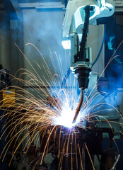 Welding robots movement in a car factory