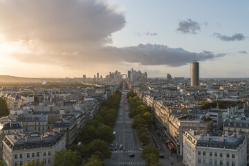 Paris city skyline, La Defense and Champs Elysées at dusk