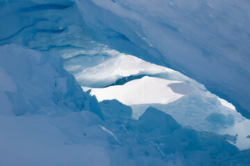 Antarctica inside a blue iceberg on a sunny winter day