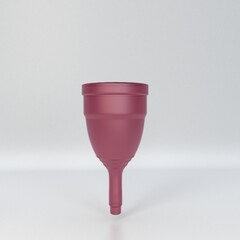 Red silicone menstrual cup isolated on white background. Means of female hygiene.