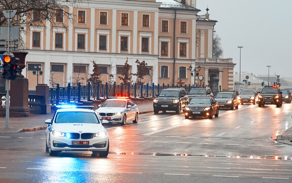 Minsk, Belarus - Dec 2018. Presidential cortege of Alexander Lukashenko moves through the streets of Minsk. Police cars speeding down the street with siren and lights. Inscription on car "Police".