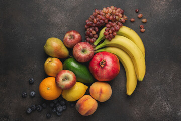 Various of fruits on brown concrete background. Healthy food to immune system