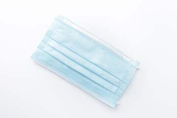 Fototapeta premium Surgical mask isolated on white background.Concept : Medical waste disposal during the novel COVID-19 pandemic.