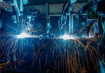 Welding robots movement in a car factory.