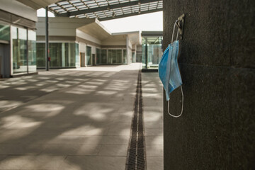 Antivirus mask in an empty abandoned market mall